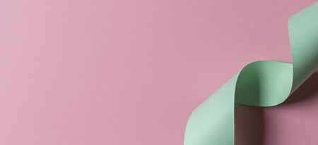 Abstract geometric shape light green and pink color paper backgroundの写真素材