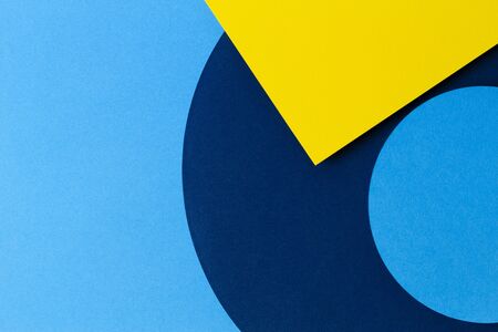 Abstract colored paper texture background. Minimal geometric shapes and lines in light blue, navy...