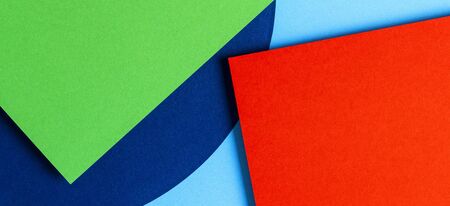 Abstract colored paper texture background. Minimal geometric shapes and lines in red, light blue,...