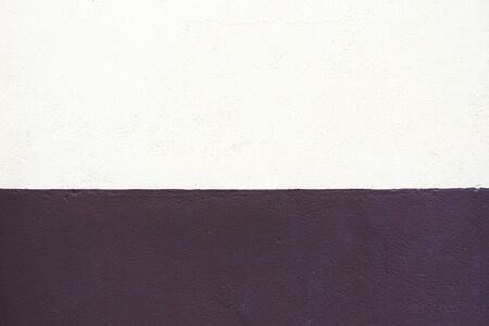 Abstract two colors wall texture background. Old concrete wall painted in half white and brown...