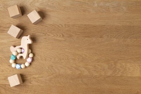 Baby kid educational natural eco zero waste wooden toys on wood background. Top view