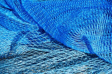 Commercial blue color fishing nets background