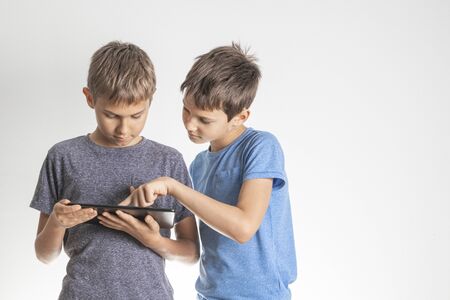 Children using digital tablet pc computer. Technology, online learning, education, distance...