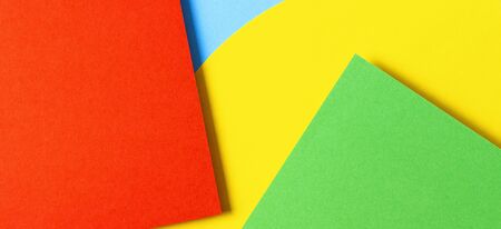 Abstract colored paper texture background. Minimal geometric shapes and lines in yellow, light blue, red, green colorsの写真素材