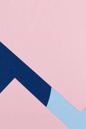 Abstract colored paper texture background. Minimal geometric shapes and lines in pastel blue, light pink and navy coloursの写真素材