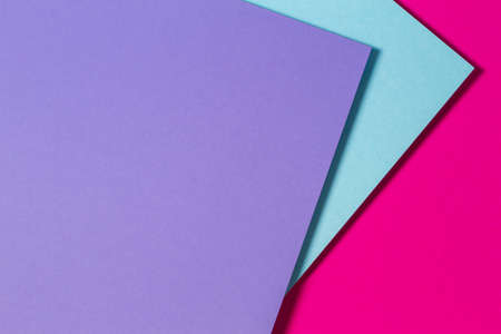 Abstract color papers geometry flat lay composition banner background with purple, blue and magenta...