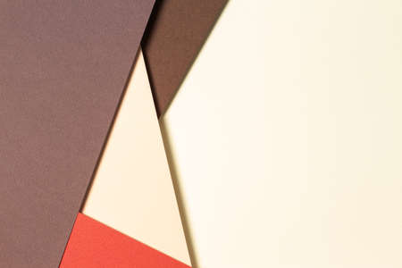Abstract geometric paper background in earth tones. Beige, yellow, coral, brown colors backgroundの写真素材