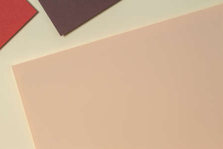 Abstract geometric paper background in earth tones. Beige, coral, brown colors background