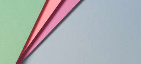 Abstract color papers geometry flat lay composition banner background with green, pink, purple, blue...