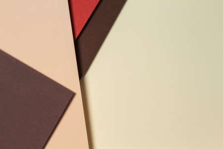 Abstract geometric paper background in earth tones. Beige, yellow, coral, brown colors backgroundの写真素材