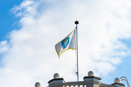 Druskininkai, Lithuania, August 14, 2020. Flag of Druskininkai municipality over blue sky background in Druskininkai Lithuaniaのeditorial素材