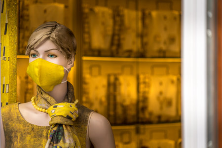 Vilnius, Lithuania- September 4, 2020: Woman manequin wear protective mask inside clothing storeのeditorial素材