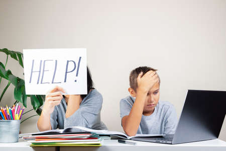 Learning difficulties, remote education, online learning and working at home. Tired mother and sad...