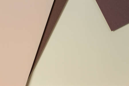 Abstract color papers geometry composition background with yellow, beige and brown tones