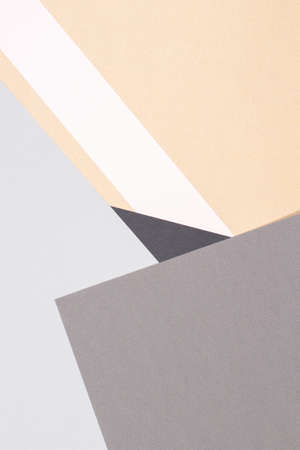 Creative abstract geometric paper background light gray, black colors and brown craft paper. Top...
