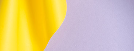 Abstract creative geometric curved shape yellow and light gray color paper backgroundの写真素材