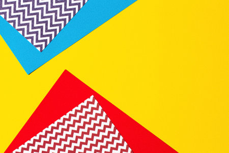 Abstract geometric fashion papers texture background in yellow, red, pink, blue colors. Top view, flat layの写真素材