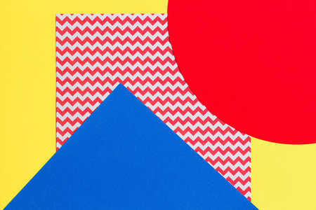 Abstract geometric fashion papers texture background in yellow, pink, red, blue colors. Top view,...