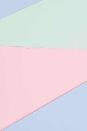 Abstract colored paper texture background. Minimal geometric shapes and lines in blue, light green, pastel pink coloursの写真素材