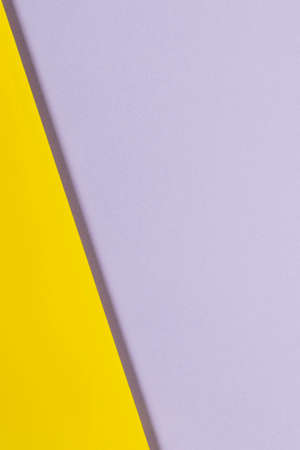 Abstract geometric paper background in yellow and gray colors. Top view