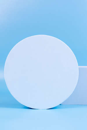 Abstract background trendy composition with geometric shapes forms. Exhibition podium, platform for product presentation on light blue backgroundの写真素材