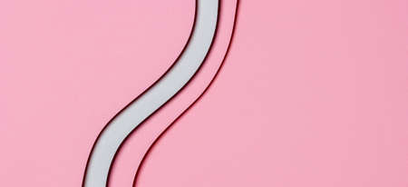 Abstract colored paper texture background. Minimal geometric shapes and lines in pastel pink and light gray colorsの写真素材