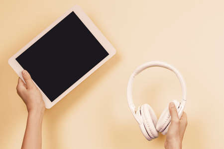 Online learning, remote education, e-learning concept. Hands holding digital tablet and wireless...