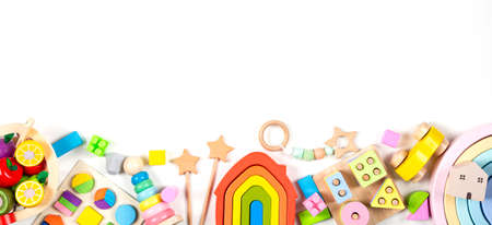 Baby kids toy banner background. Colorful educational toys on white background. Top view, flat lay, copy space for textの写真素材