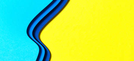 Abstract color papers geometry flat lay composition background with blue and yellow tonesの写真素材