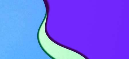 Abstract geometric paper texture banner background. Blue purple green waves and curved lines papercut composition. Top viewの写真素材