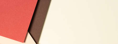 Abstract geometric paper background in earth tones. Beige, yellow, coral, brown colors backgroundの写真素材