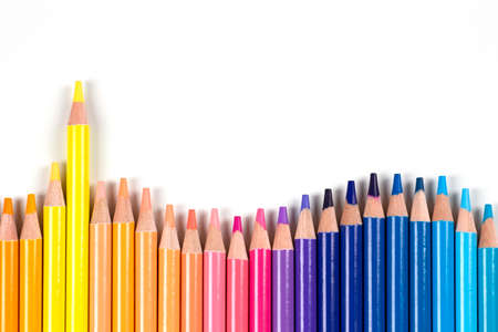 Colored pencils frame on white background. Top view. Learning, art, diversity, creative entertainment conceptの写真素材