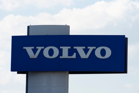 Volvo automobile dealership sign and logo. Volvo is Swedish multinational manufacturing company, provider of cars, busesのeditorial素材
