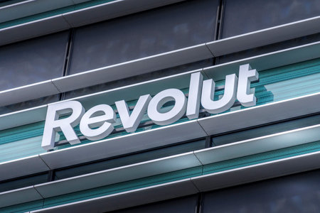 Revolut logo signboard on modern office building in Vilnius, Lithuania on May 30, 2021. Revolut is...