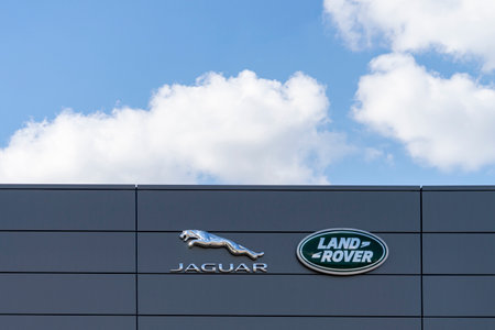 Jaguar Land Rover brand logo sign near oficial dealer office showroom building located in Vilnius, Lithuania - May 12, 2021のeditorial素材