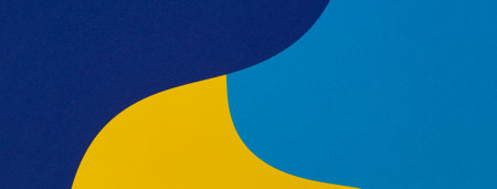 Creative abstract blue and yellow color geometric paper composition banner background, top viewの写真素材