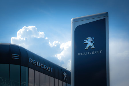 Vilnius, Lithuania - October 09, 2021: Peugeot automobile dealership sign and logo outdoors. Peugeot is French brand of automobiles, part of PSA Peugeot Citroen groupのeditorial素材