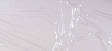 Transparent film cellophane background. White wrinkled stretched plastic texture backgroundの写真素材