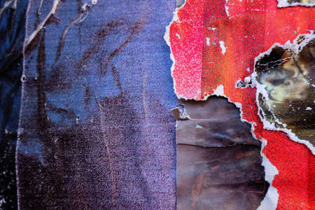 Old black and yellow grunge ripped torn collage posters creased crumpled paper placard texture backgroundの写真素材