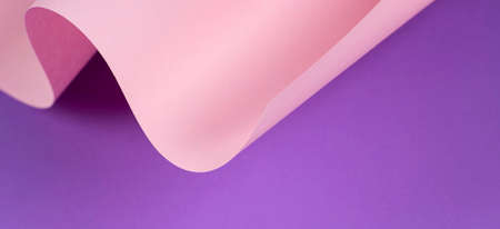Abstract wave of pastel pink and purple paper. Creative geometric curved paper with light and shadows. Abstract geometry background with copy spaceの写真素材