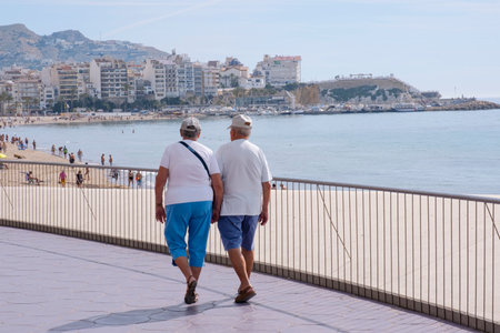 Benidorm, Spain, March 12, 2020. Tourists enjoying sunny day in Benidorm, Alicante, Spainのeditorial素材
