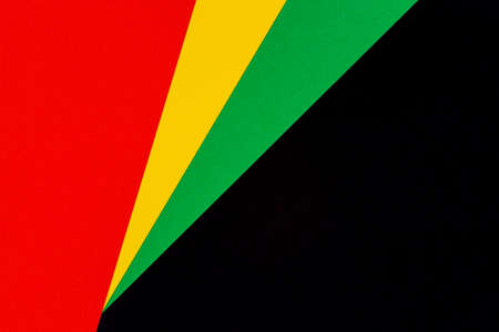Abstract geometric black, red, yellow, green color background. Black History Month color background with copy space for textの写真素材