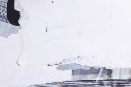 Old white grunge ripped torn collage posters creased crumpled paper placard texture background with copy space for text or imageの写真素材