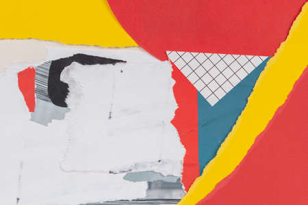 Old grunge ripped torn collage posters creased crumpled paper placard texture background with red, yellow, white, blue colorsの写真素材