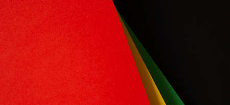 Black History Month color background. African American history month celebration. Abstract red, yellow, green, black color paper backgroundの写真素材