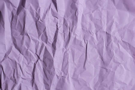 Abstract old wrinkled creased purple color paper texture backgroundの写真素材