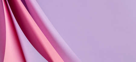 Abstract colored paper geometry composition background in violet, purple, magenta, pink color with...