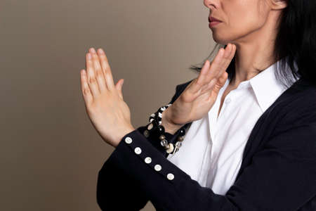 Break The Bias. Crossed hands symbol of International Womens day. Woman arms crossed to show solidarity, commitment to calling out bias, breaking stereotypes, inequality, rejecting discriminationの写真素材