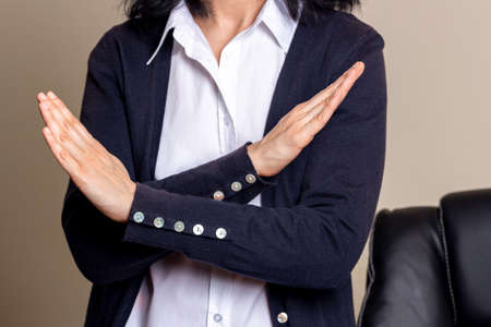 Crossed hands. Break the bias symbol of womans international day. Woman arms crossed to show solidarity, commitment to calling out bias, breaking stereotypes, inequality, rejecting discriminationの写真素材