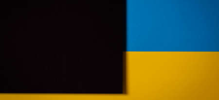 Abstract color papers geometry flat lay composition background with blue, yellow, black tonesの写真素材